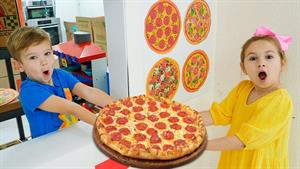 بچه ها طرز پخت پیتزا را یاد می گیرند و به یکدیگر کمک می کنند
