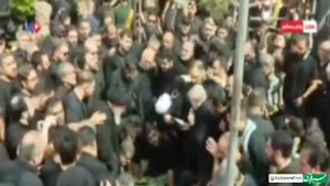 پیکر شهید حاجی‌زاده و شهید محمود باقری در قطعۀ ۵۰، قطعۀ شهدا